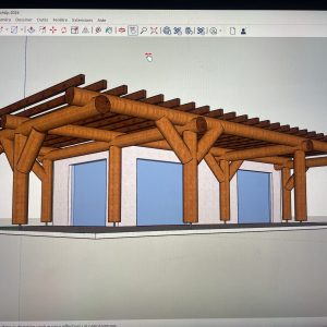 Cabane en bois avec une structure en rondins et de grandes fenêtres, offrant une vue dégagée.